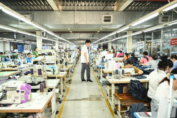 sleepwear production workers manufacturing custom pajamas in factory
