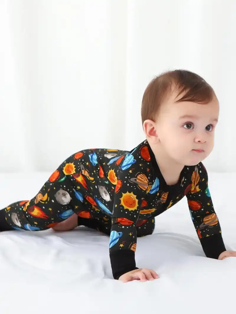 Bulk baby boy zipper rompers with printed designs.